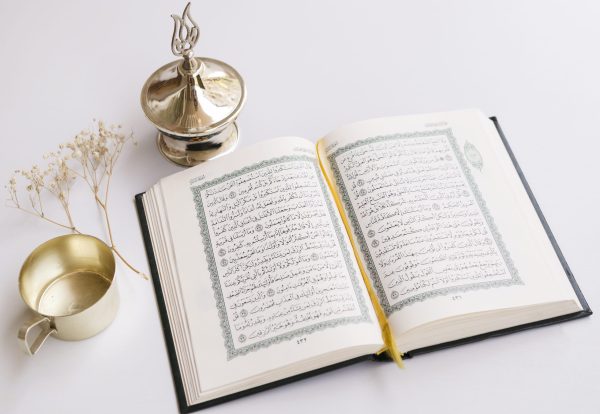 close-up-opened-quran-table-scaled.jpg