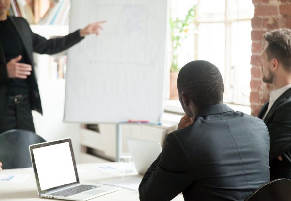 team-businessmen-listening-business-lecture-during-briefing-scaled.jpg